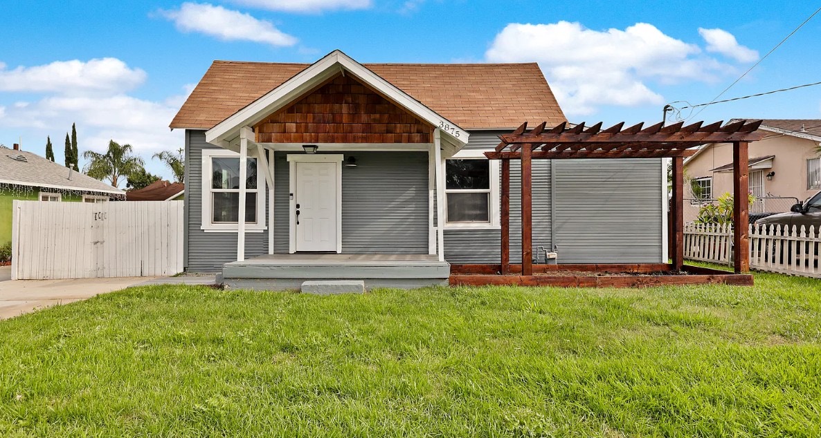 Bungalow with new siding paint, porch, and cedar pergola