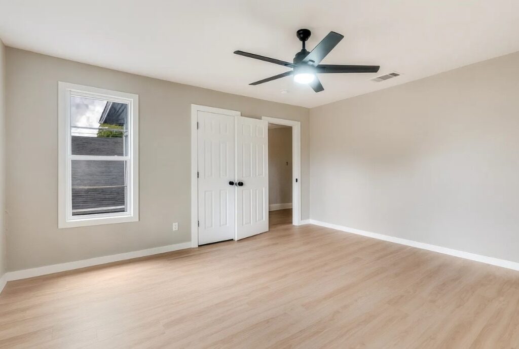 Bedroom remodel with double closet doors and new flooring