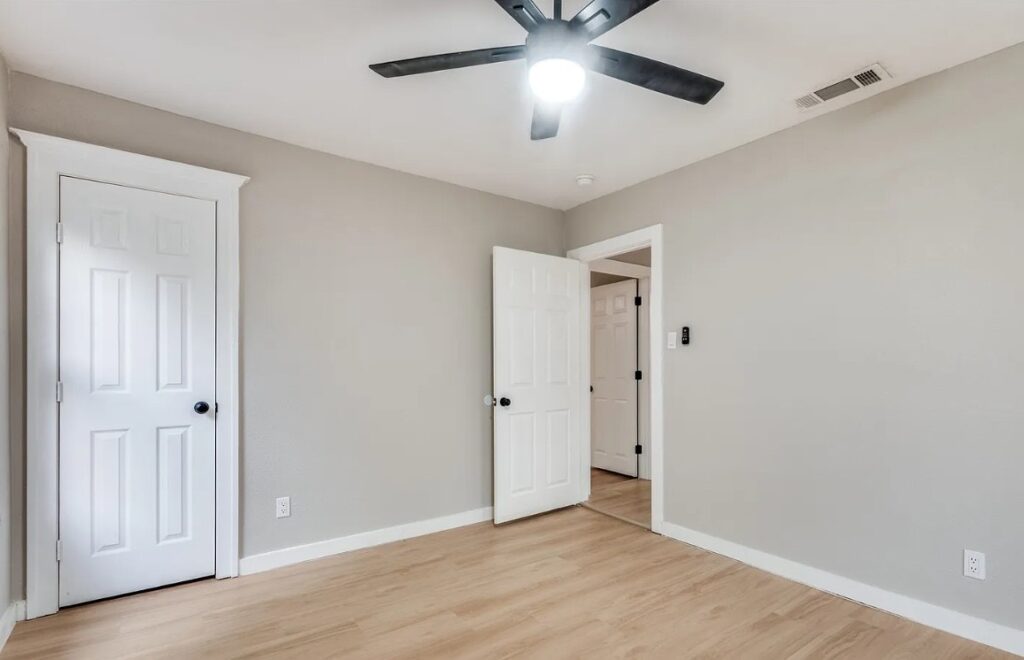 Bedroom renovation with new six-panel doors and fresh paint